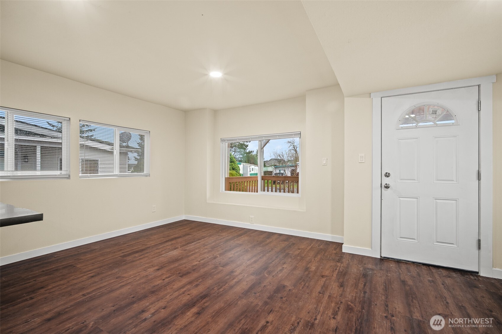 2392 Douglas Road, Unit 4 Ferndale, WA 98248 - Photo 14 of 39 a view of an empty room with wooden floor and a window