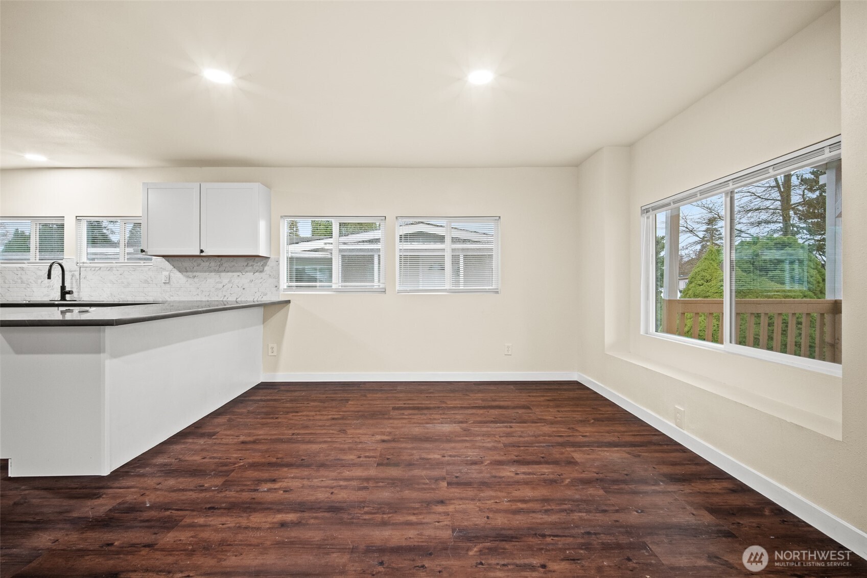 2392 Douglas Road, Unit 4 Ferndale, WA 98248 - Photo 15 of 39 a view of a kitchen with a sink wooden cabinets and a window