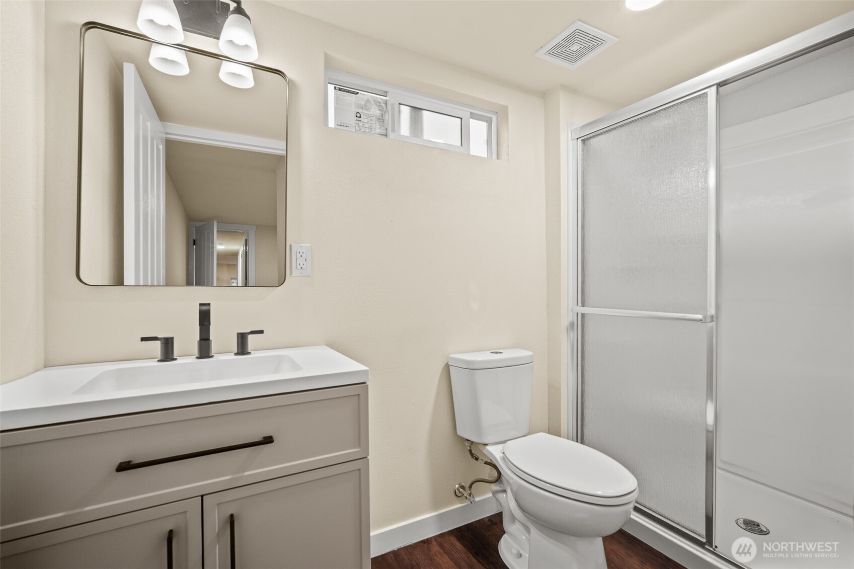 2392 Douglas Road, Unit 4 Ferndale, WA 98248 - Photo 18 of 39 a bathroom with a toilet a sink a vanity and mirror