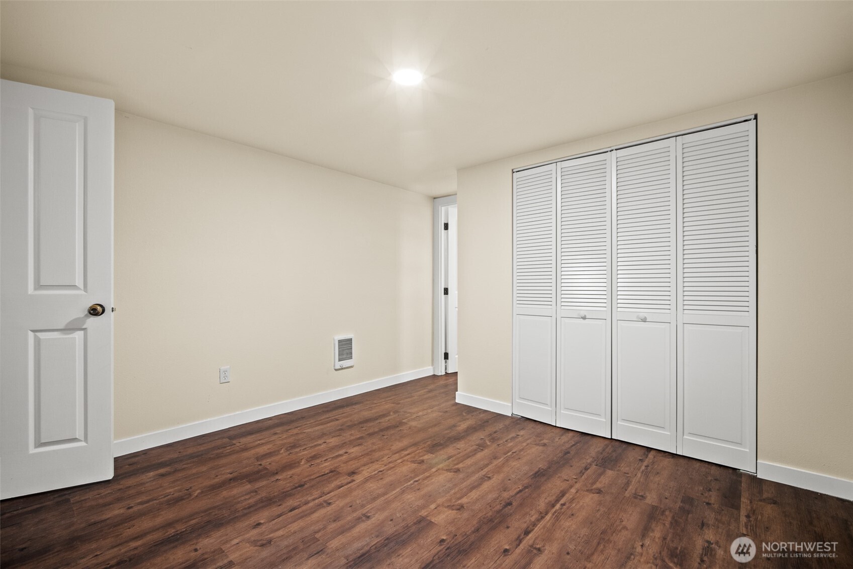 2392 Douglas Road, Unit 4 Ferndale, WA 98248 - Photo 19 of 39 a view of an empty room with wooden floor
