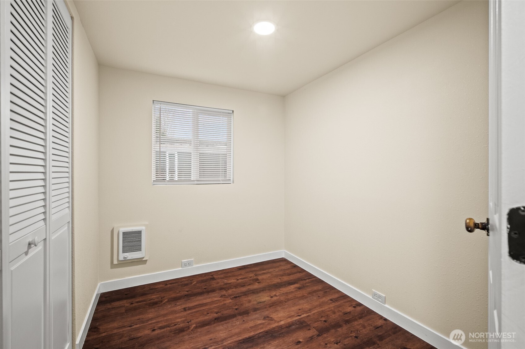 2392 Douglas Road, Unit 4 Ferndale, WA 98248 - Photo 23 of 39 a view of an empty room with wooden floor and a window