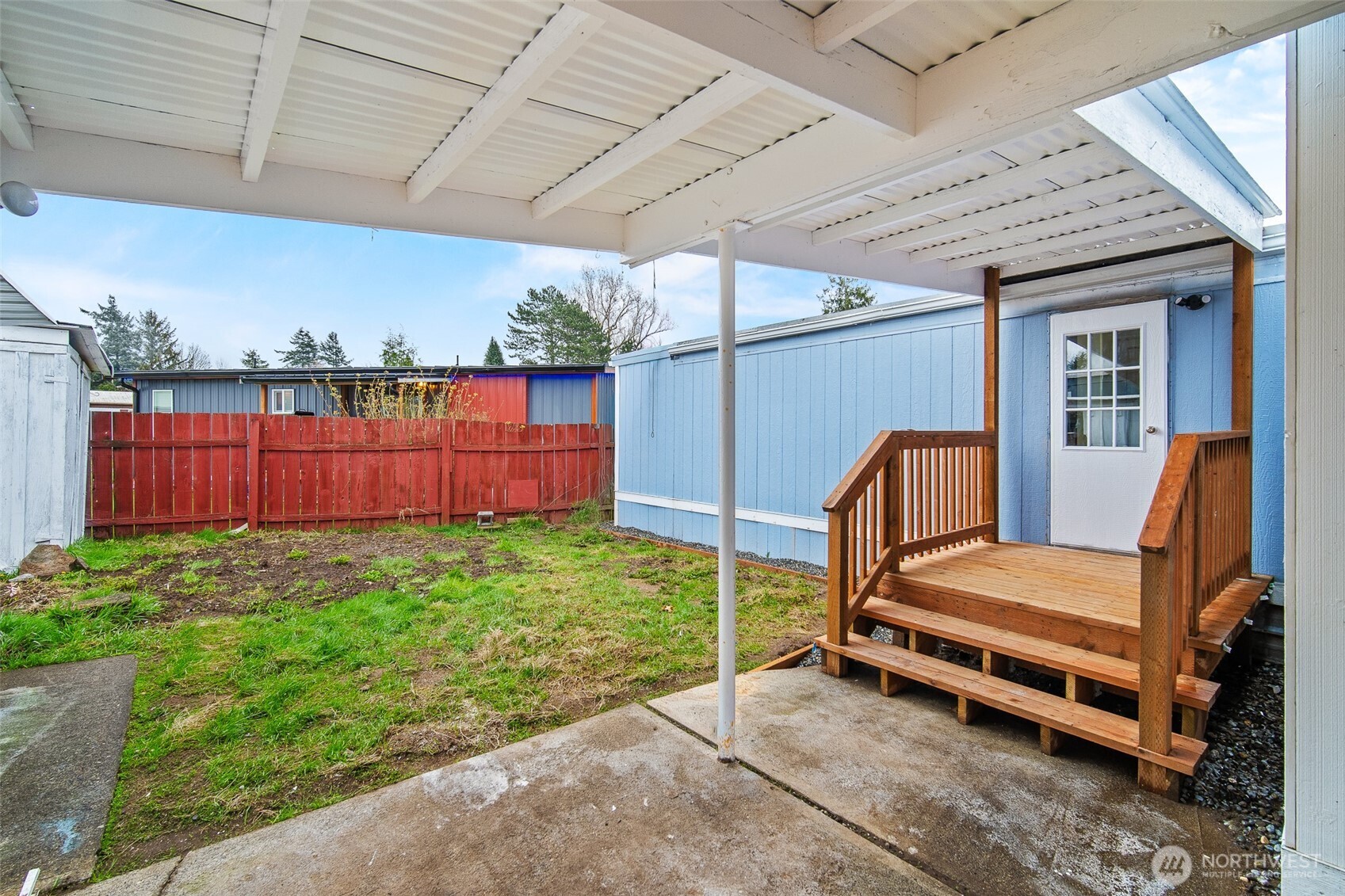 2392 Douglas Road, Unit 4 Ferndale, WA 98248 - Photo 28 of 39 a view of a backyard with hardwood and deck