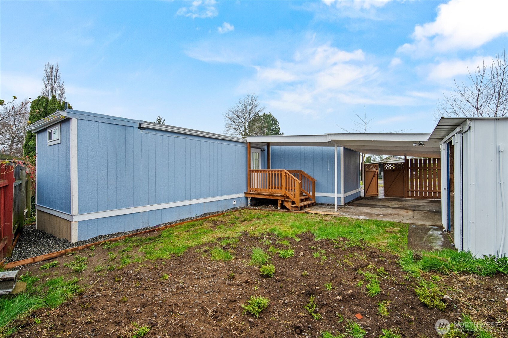 2392 Douglas Road, Unit 4 Ferndale, WA 98248 - Photo 31 of 39 a view of a house with backyard and sitting area