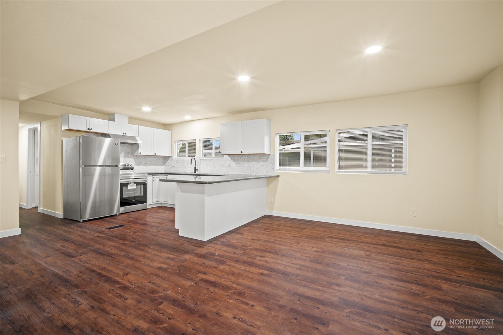 2392 Douglas Road, Unit 4 Ferndale, WA 98248 - Photo 5 of 39 a view of kitchen with wooden floor and electronic appliances