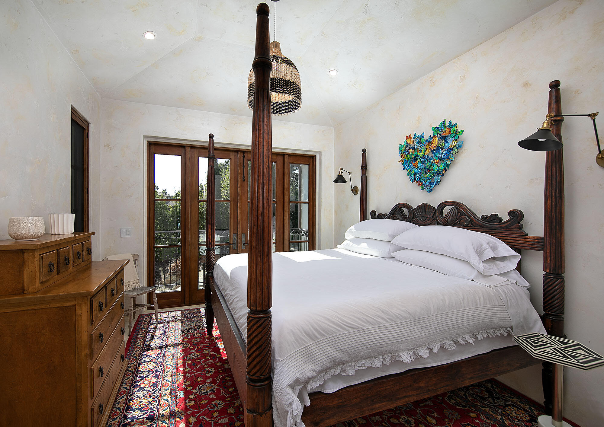 747 Via Manana Montecito, CA 93108 - Photo 37 of 49 a bedroom with a bed and a chandelier