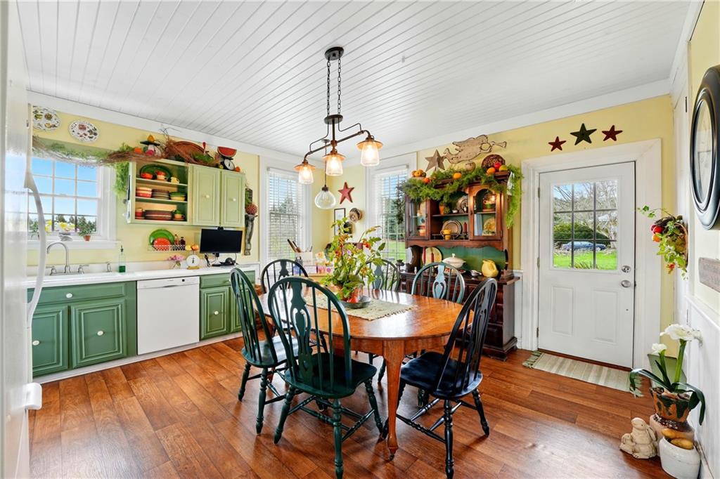 397 Evans City Road Butler, PA 16001 - Photo 13 of 50 a view of a dining room with furniture and wooden floor