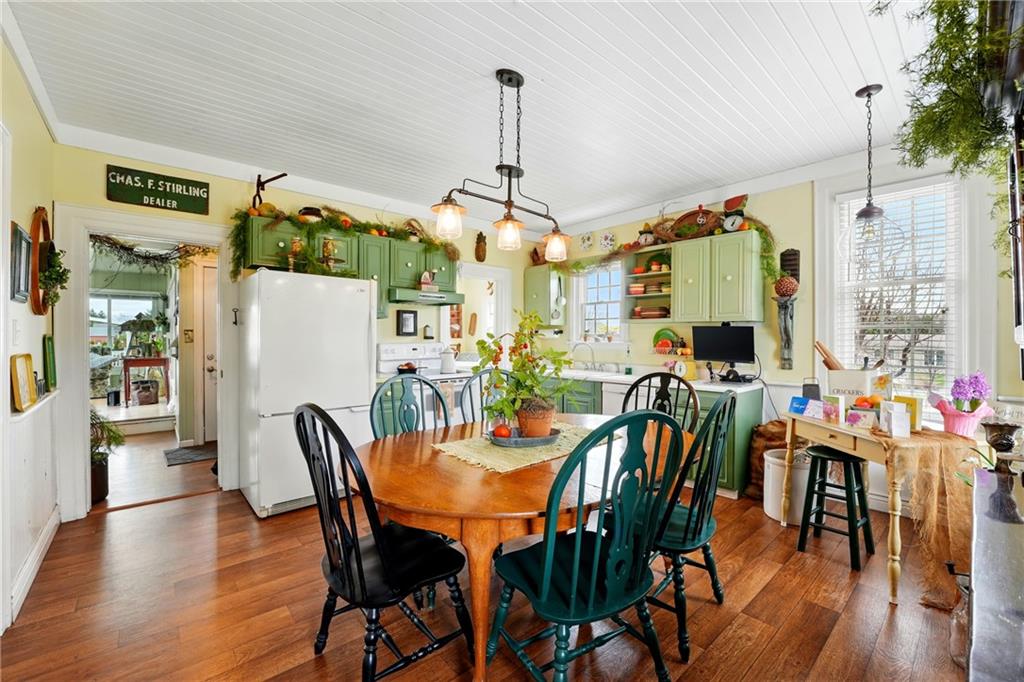 397 Evans City Road Butler, PA 16001 - Photo 14 of 50 a view of a dining room with furniture window and wooden floor