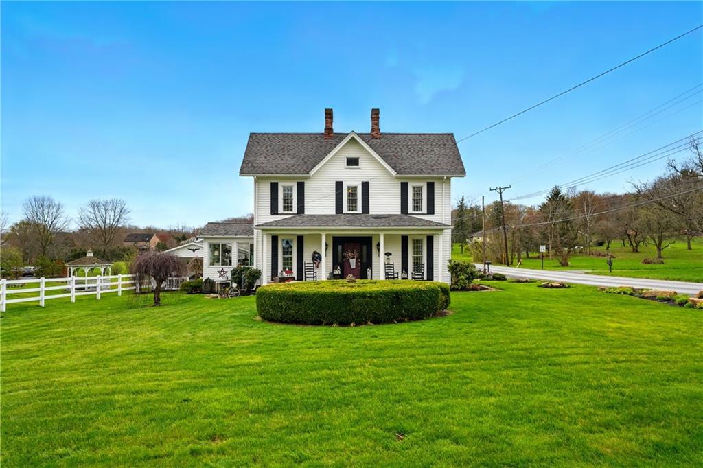 397 Evans City Road Butler, PA 16001 - Photo 2 of 50 a front view of a house with a garden