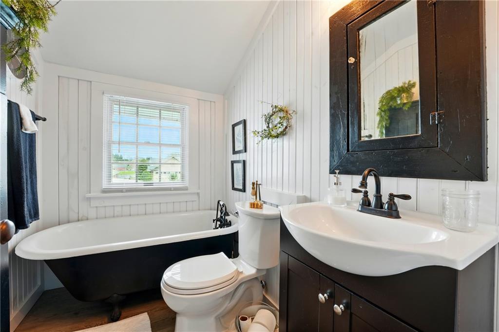 397 Evans City Road Butler, PA 16001 - Photo 27 of 50 a bathroom with a sink a toilet and a window