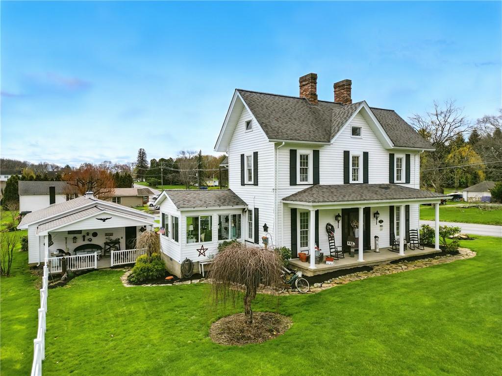 397 Evans City Road Butler, PA 16001 - Photo 3 of 50 a front view of a house with a yard