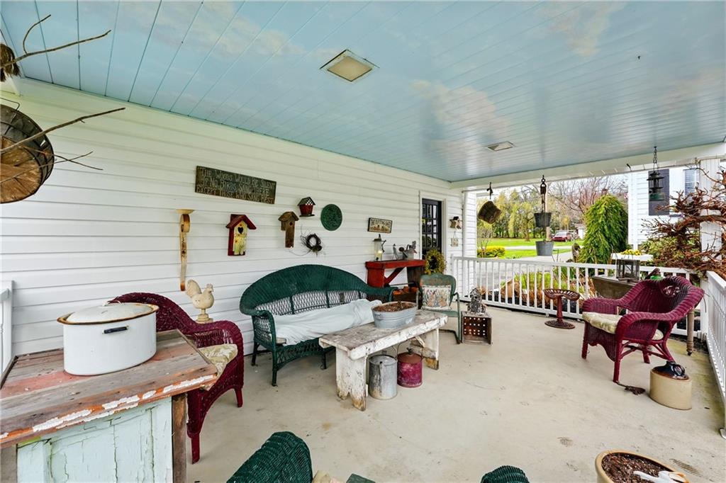 397 Evans City Road Butler, PA 16001 - Photo 32 of 50 a living room with furniture and a floor to ceiling window