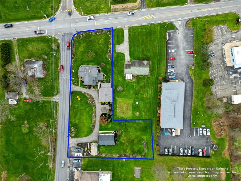 397 Evans City Road Butler, PA 16001 - Photo 47 of 50 an aerial view of a house with a garden and trees