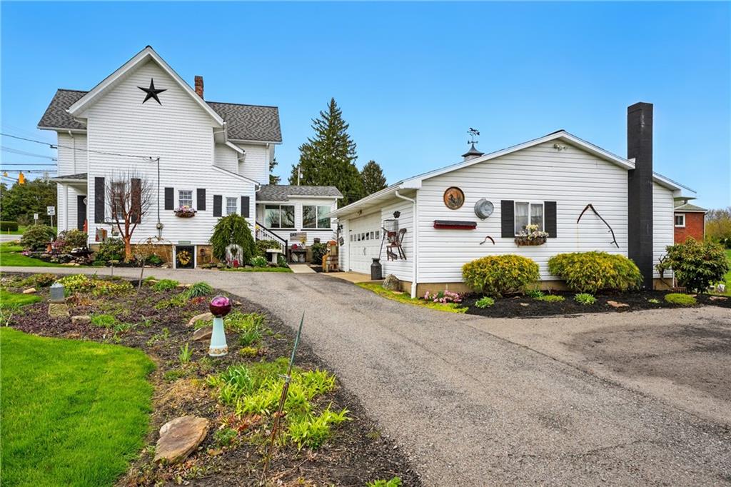 397 Evans City Road Butler, PA 16001 - Photo 49 of 50 a front view of a house with a yard