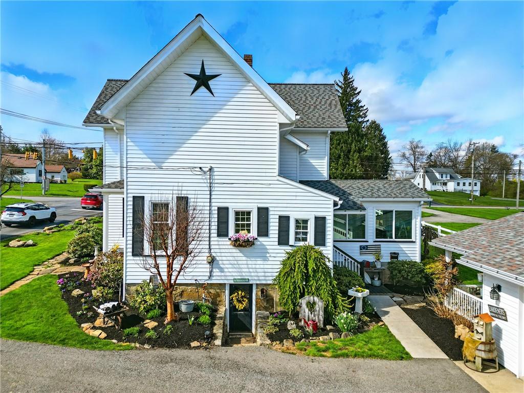 397 Evans City Road Butler, PA 16001 - Photo 7 of 50 a front view of house with yard and green space