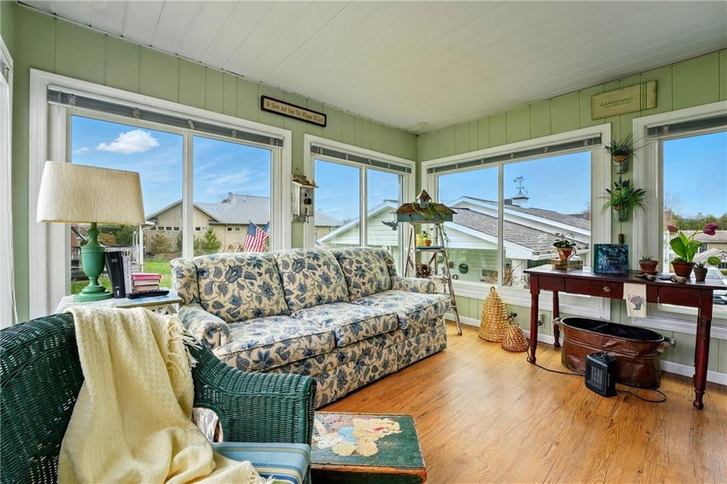 397 Evans City Road Butler, PA 16001 - Photo 10 of 50 a living room with furniture and a wooden floor