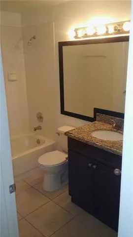 a bathroom with a toilet a sink and bathtub