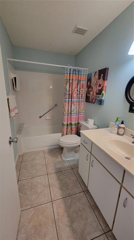 9331 Southwest 84th Terrace, Unit D Ocala, FL 34481 - Photo 25 of 32 a bathroom with a sink a toilet and shower