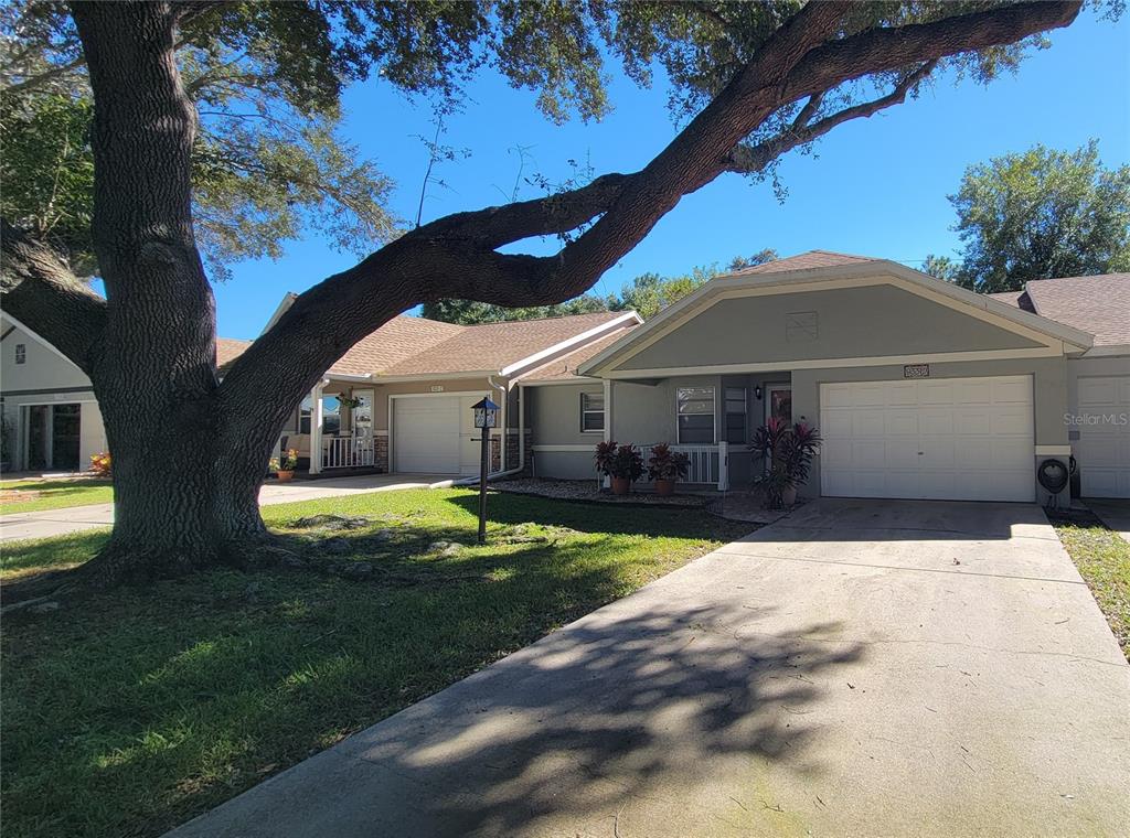 9331 Southwest 84th Terrace, Unit D Ocala, FL 34481 - Photo 3 of 32 a front view of a house with garden
