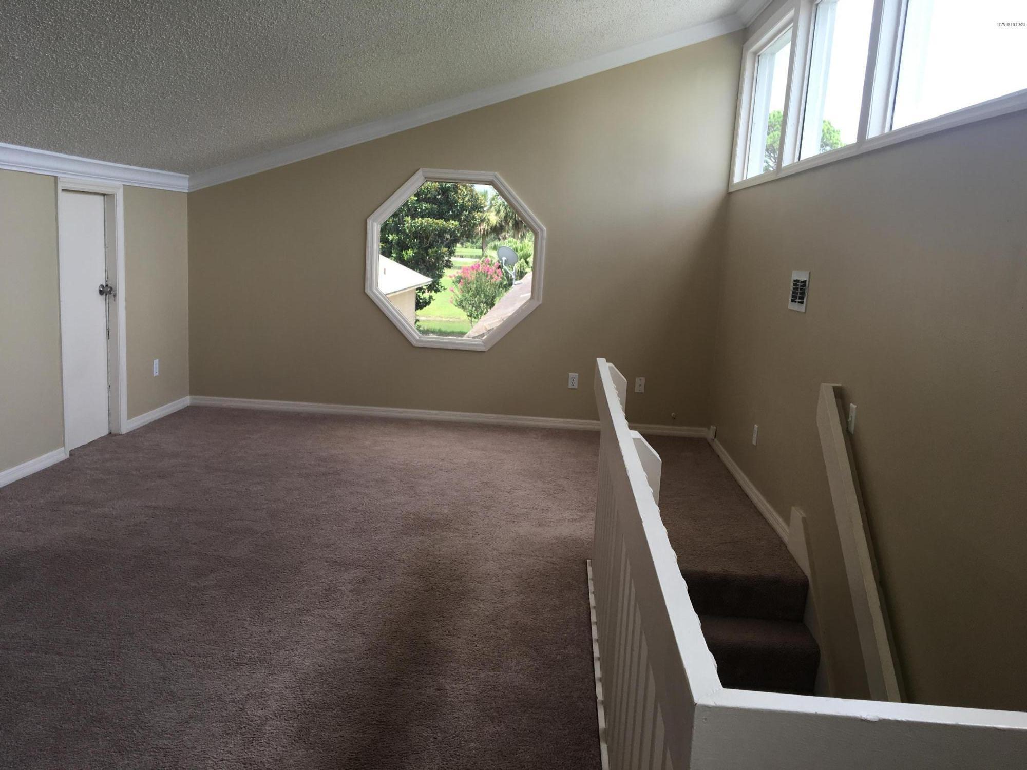 132 Tern Court Daytona Beach, FL 32119 - Photo 19 of 34 a view of an empty room with a window