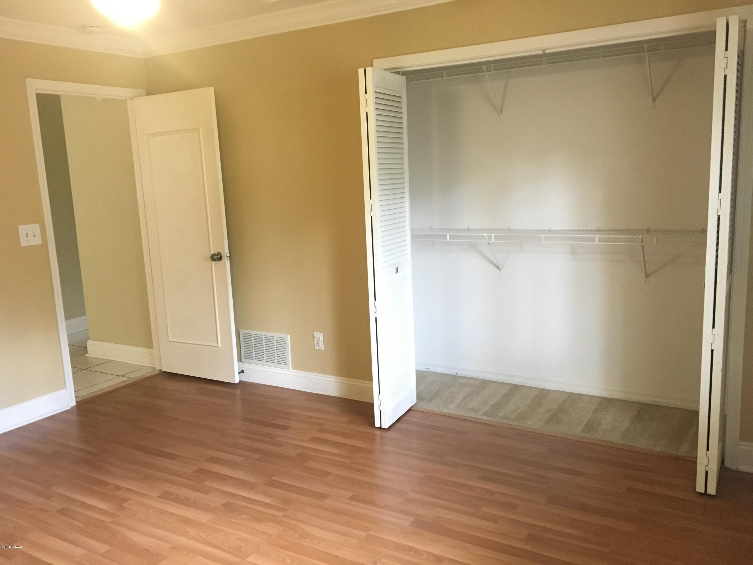 132 Tern Court Daytona Beach, FL 32119 - Photo 28 of 34 a view of empty room with wooden floor