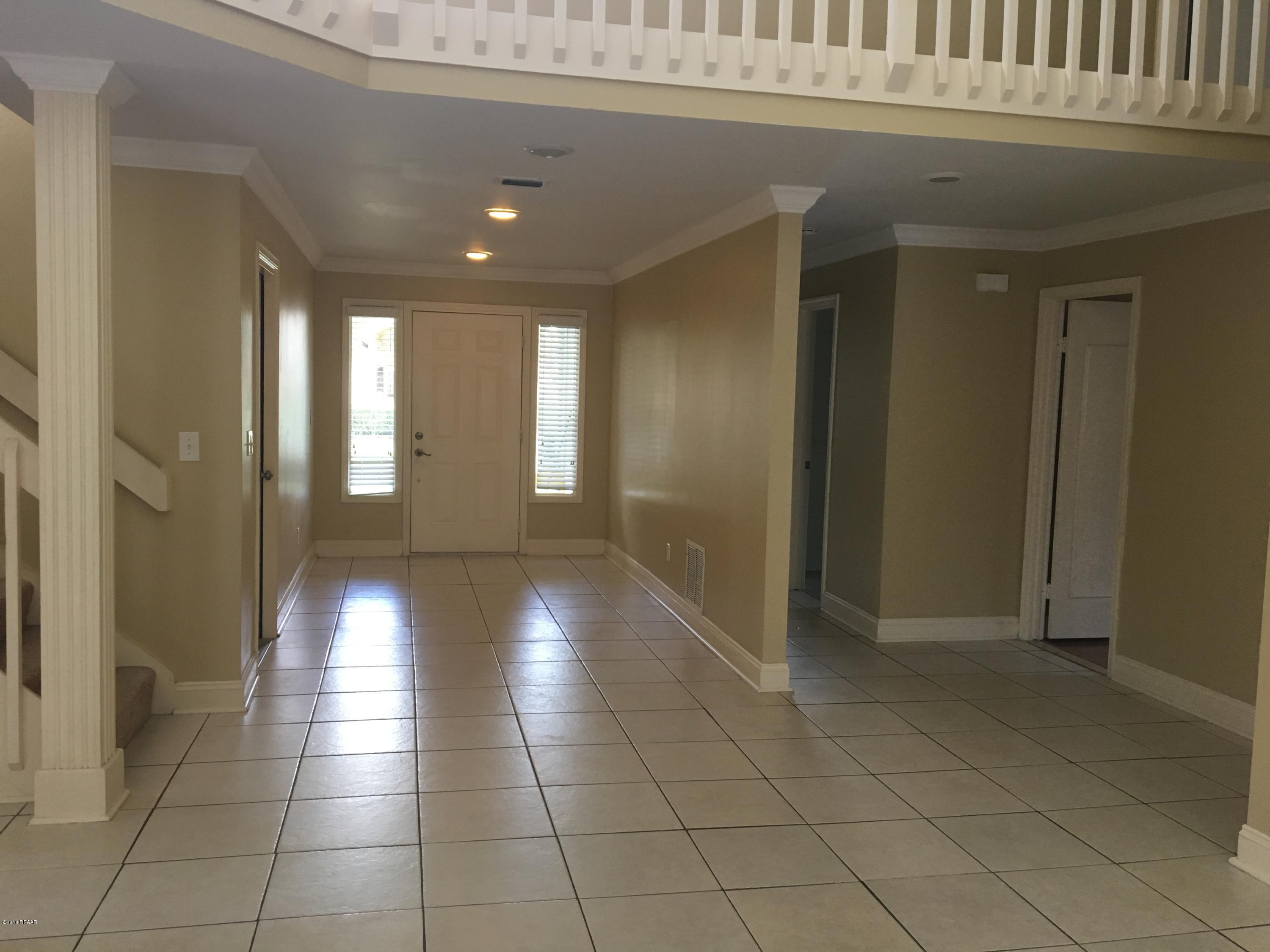 132 Tern Court Daytona Beach, FL 32119 - Photo 6 of 34 a view of a hallway with windows