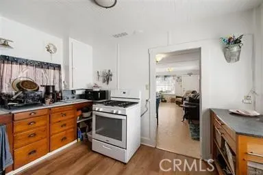 a kitchen with a stove and a sink