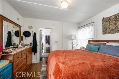 260 Pacific Street Morro Bay, CA 93442 - Photo 21 of 21 a bedroom with a large bed and a flat tv screen on dresser