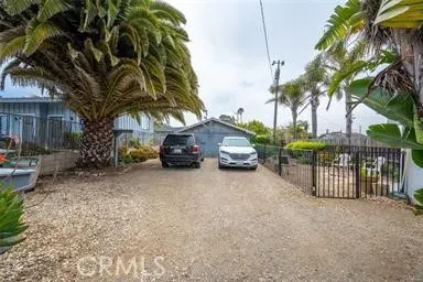 a view of a car park in front of a house