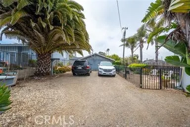 260 Pacific Street Morro Bay, CA 93442 - Photo 7 of 21 a view of a car park in front of a house