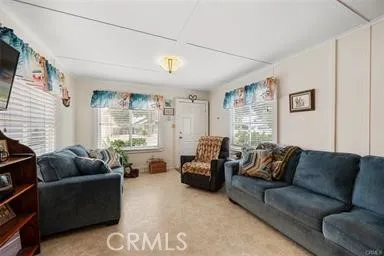 260 Pacific Street Morro Bay, CA 93442 - Photo 10 of 21 a living room with furniture and a large window