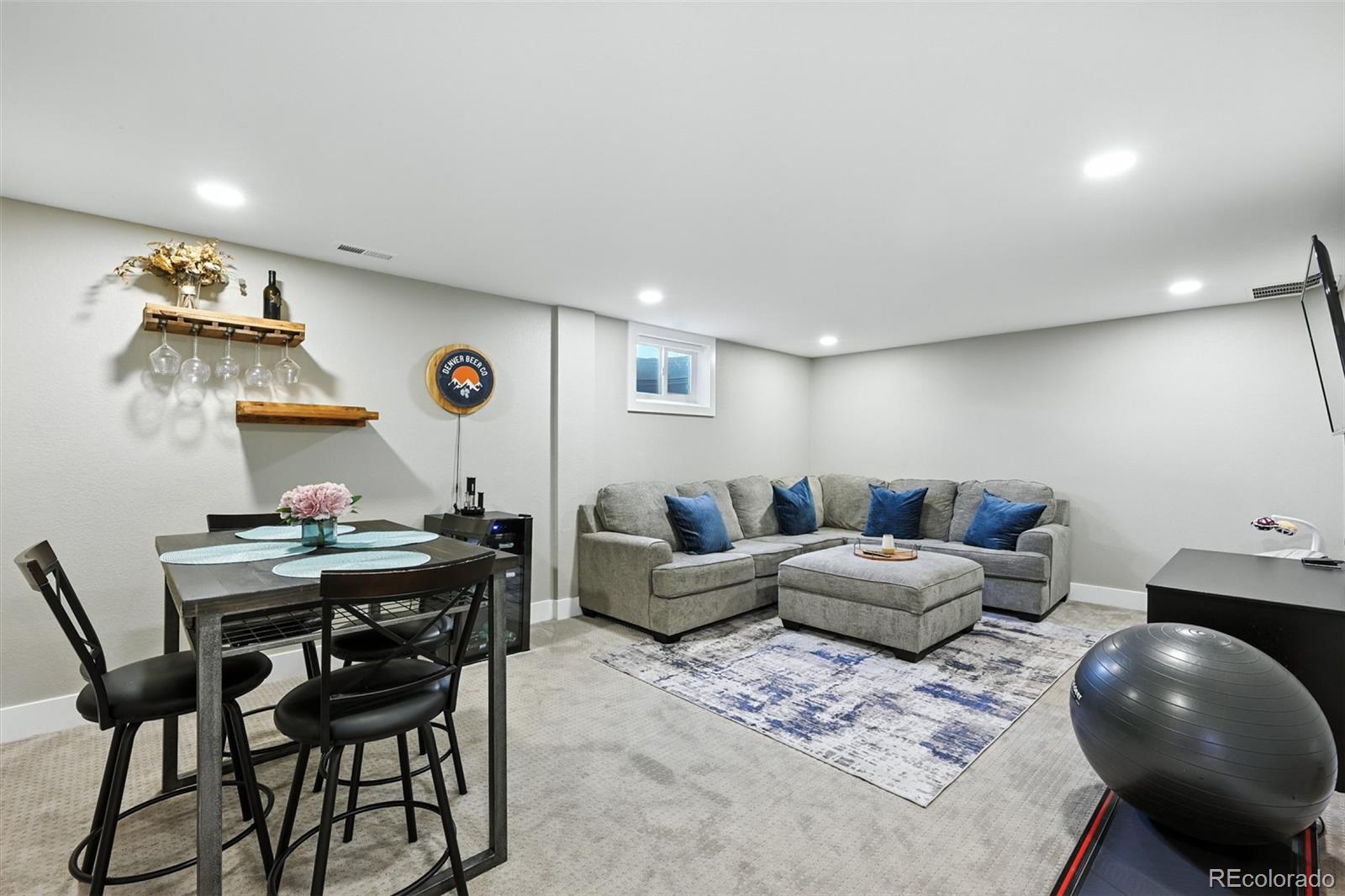 2714 South Raleigh Street Denver, CO 80236 - Photo 22 of 34 a living room with furniture and kitchen view