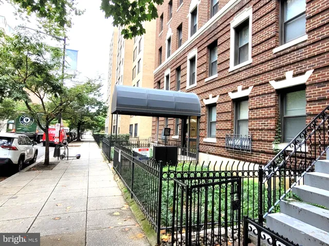 a view of a building with sitting area