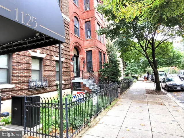 a view of a building with sitting area