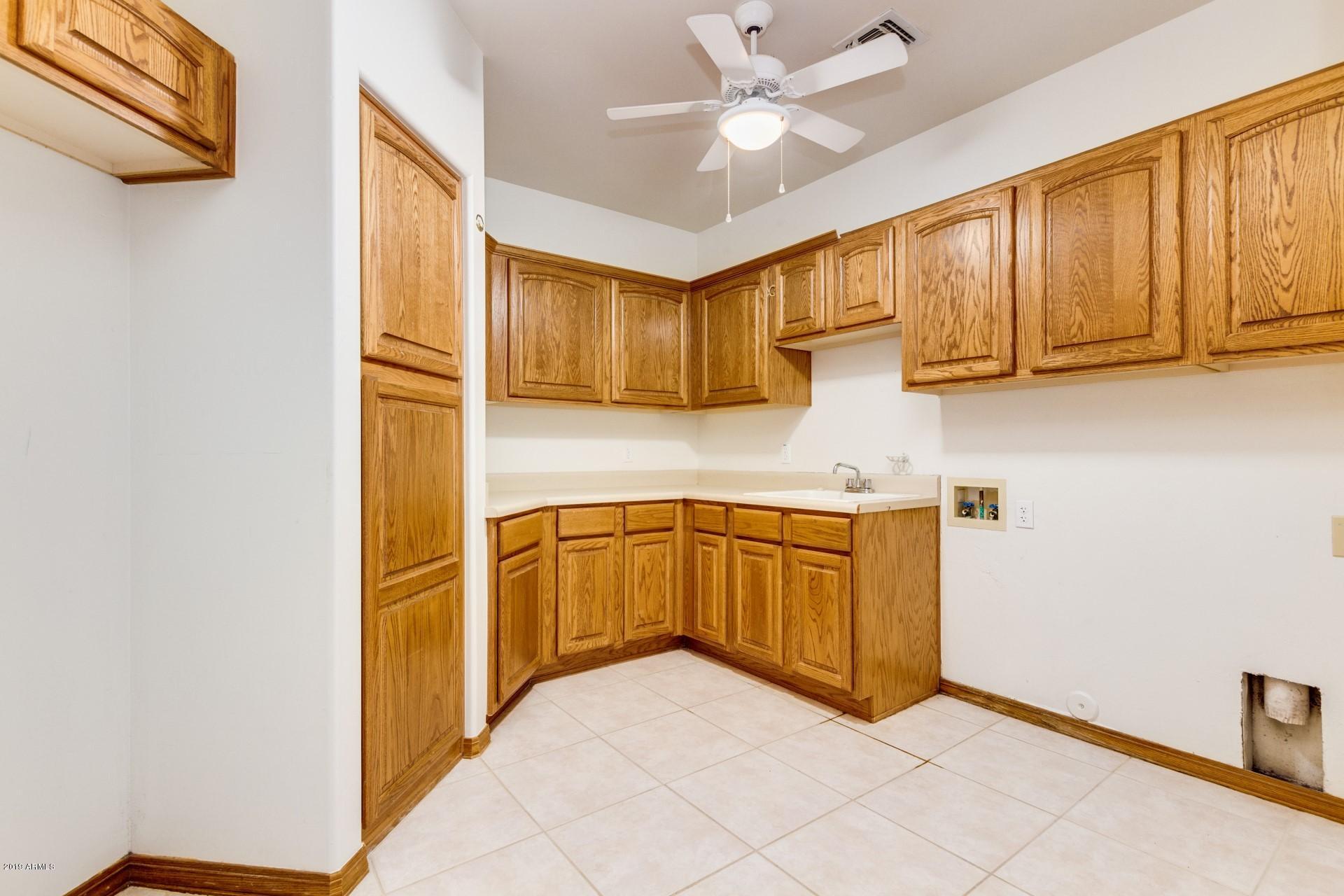 3530 North Hawes Road, Unit 11 Mesa, AZ 85207 - Photo 23 of 60 a kitchen with granite countertop cabinets stainless steel appliances and a counter space