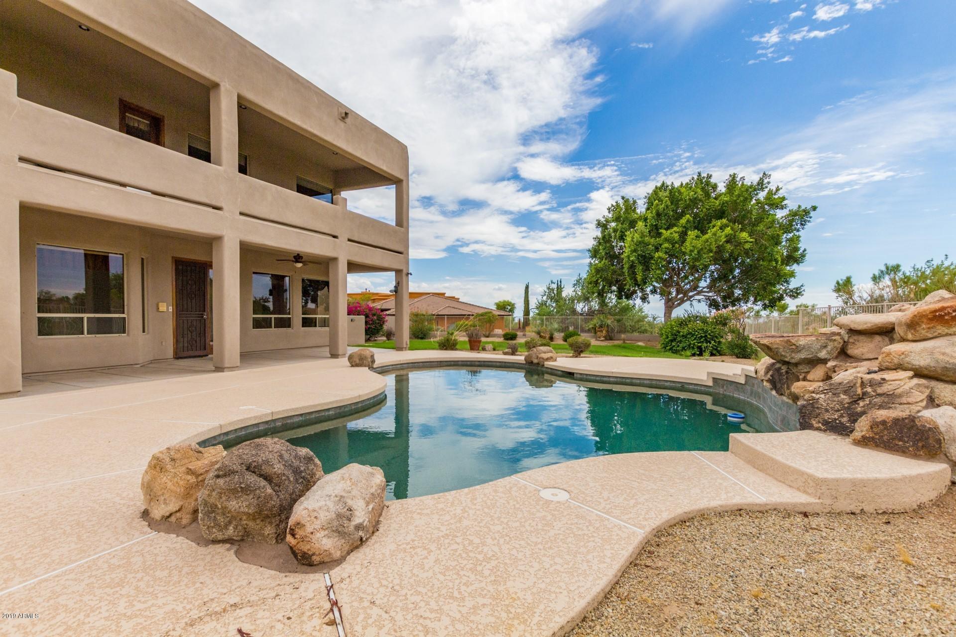 3530 North Hawes Road, Unit 11 Mesa, AZ 85207 - Photo 45 of 60 a view of a swimming pool with a patio