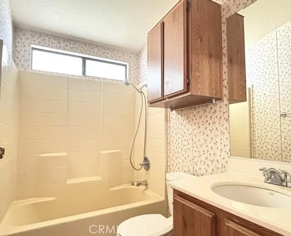 a view of an empty room and a window