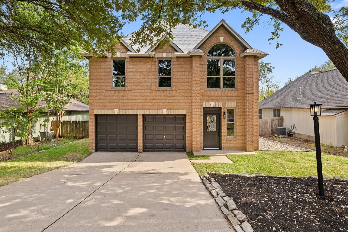 a front view of a house with yard