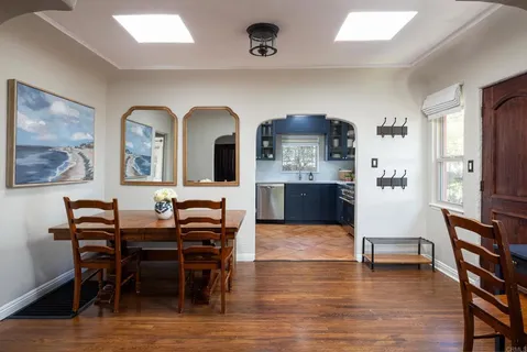 a kitchen with a stove a sink and a window