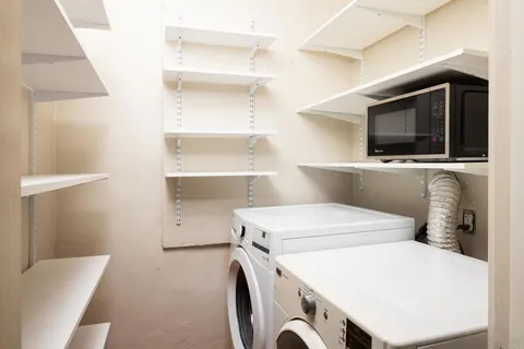 a kitchen with a stove and cabinets