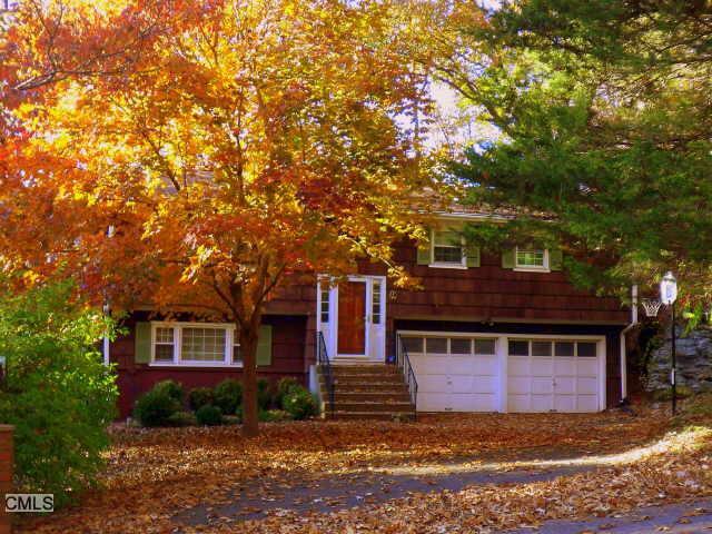 485 Nonopoge Road Fairfield, CT 06825 - Photo 1 of 1 a front view of a house with a yard