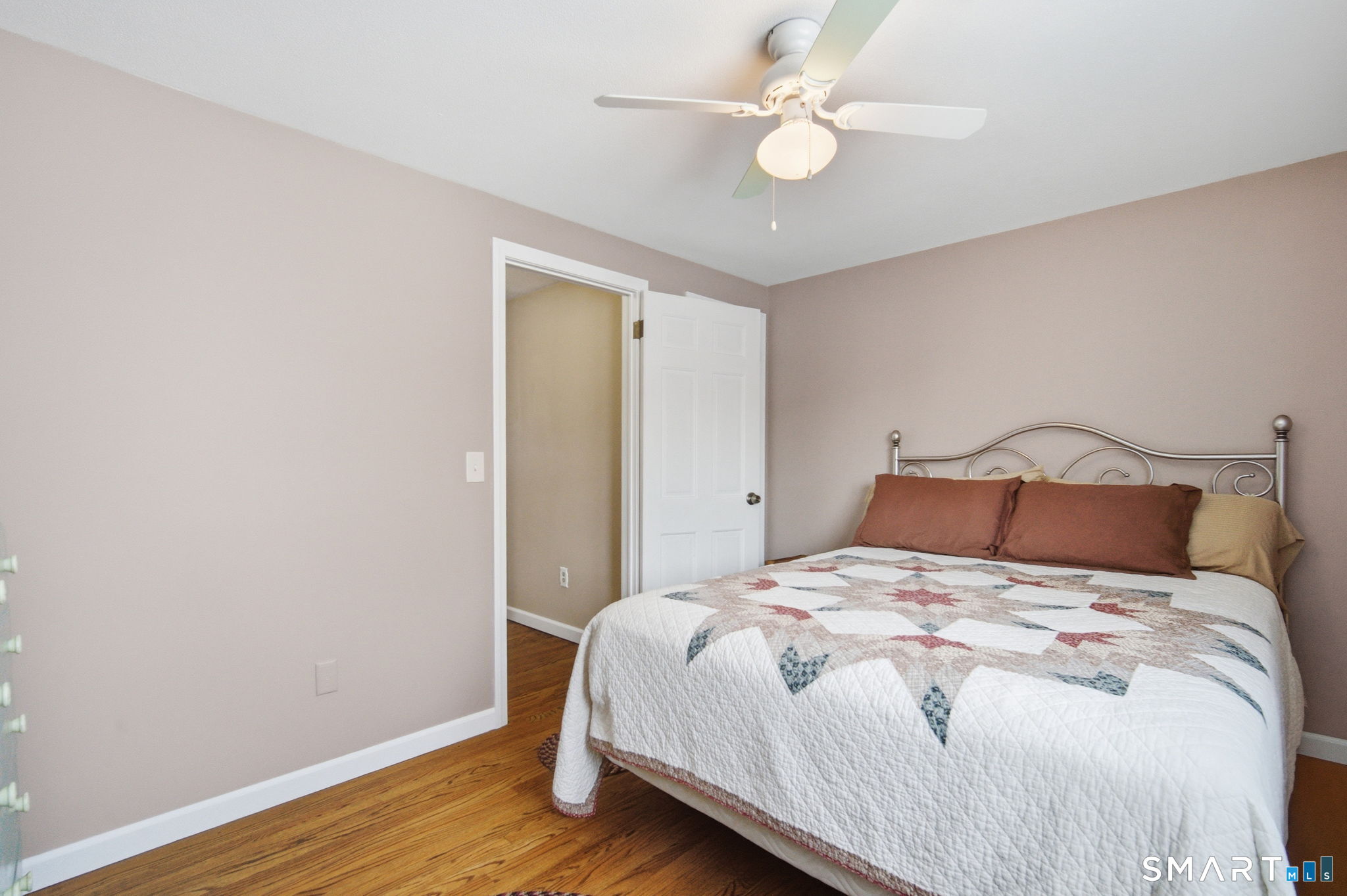 45 Sokol Road Somers, CT 06071 - Photo 26 of 36 a bedroom with a bed and wooden floor