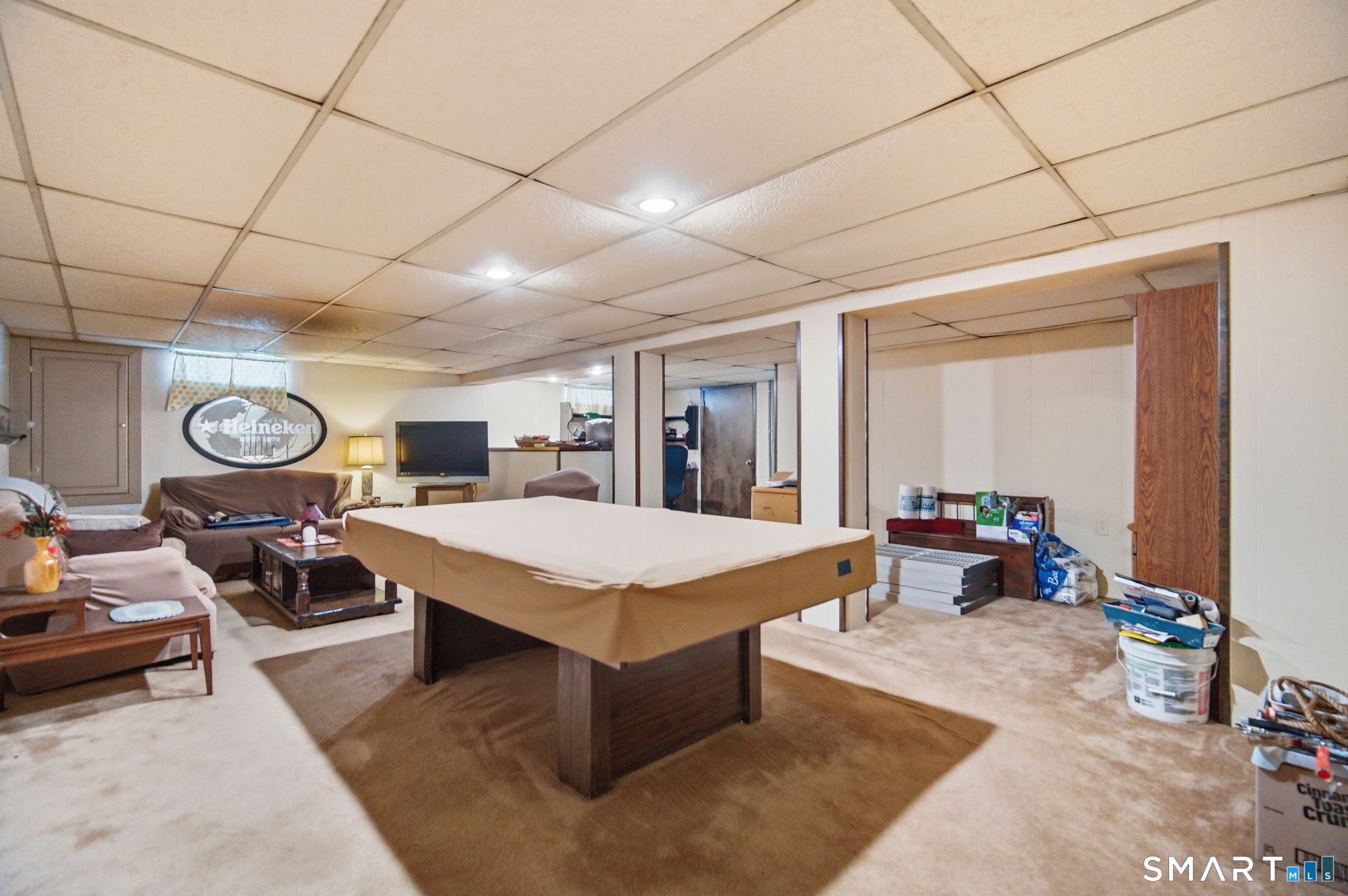 45 Sokol Road Somers, CT 06071 - Photo 30 of 36 a living room with furniture a clock on wall and a window