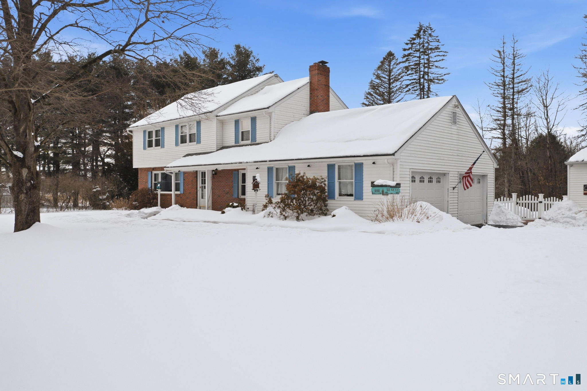 45 Sokol Road Somers, CT 06071 - Photo 3 of 36 a view of a white house with a yard covered in snow