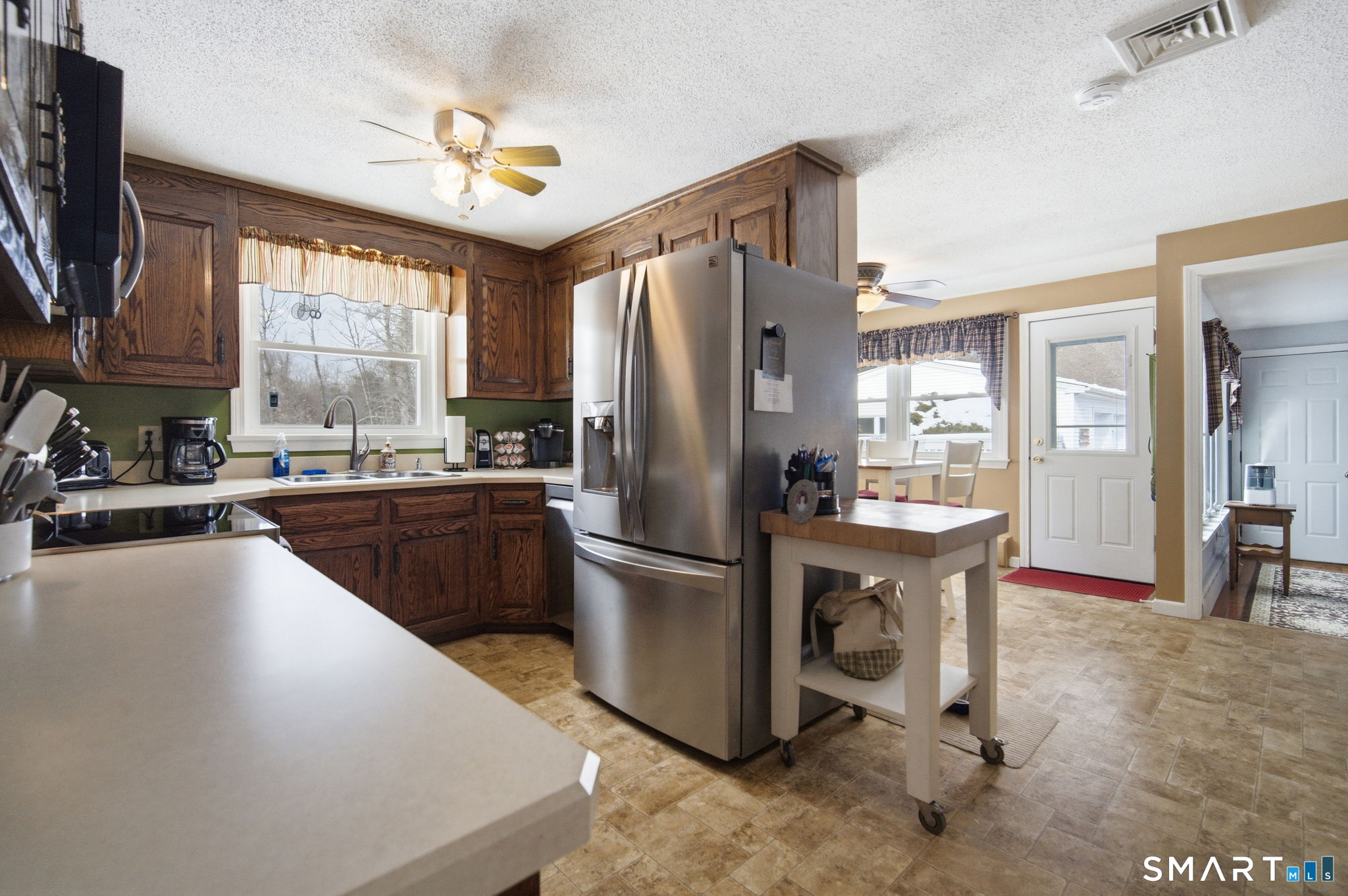 45 Sokol Road Somers, CT 06071 - Photo 6 of 36 a kitchen with a sink appliances and cabinets
