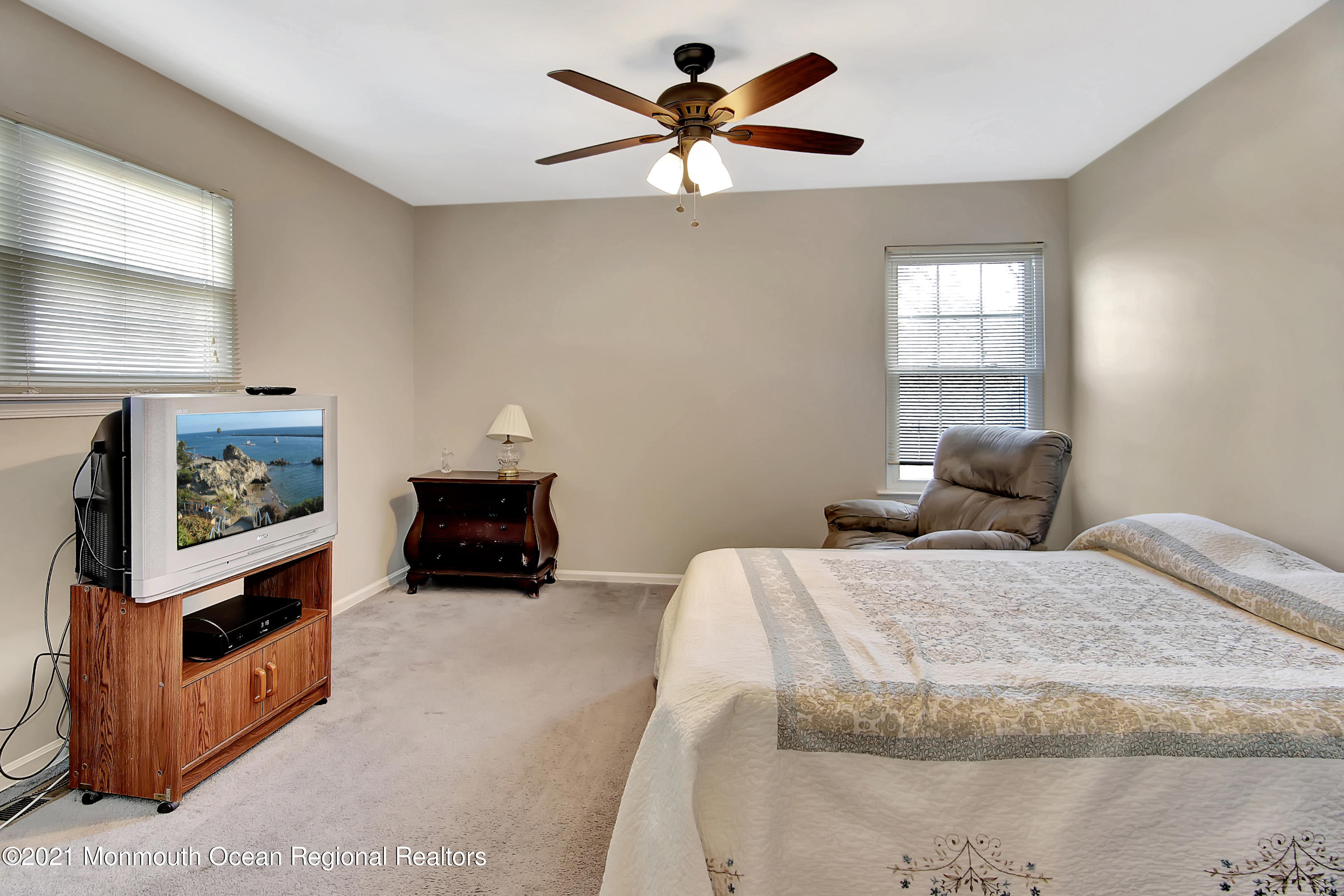 107 Starlight Road Howell, NJ 07731 - Photo 22 of 32 a bed room with a bed and a television