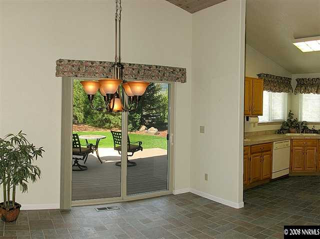 22886 Blackwillow Way Reno, NV 89521 - Photo 4 of 9 a living room with furniture and a floor to ceiling window