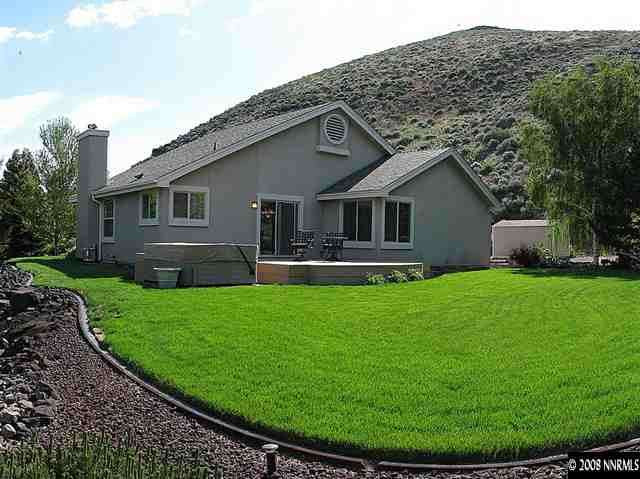 22886 Blackwillow Way Reno, NV 89521 - Photo 8 of 9 a view of a house with a backyard
