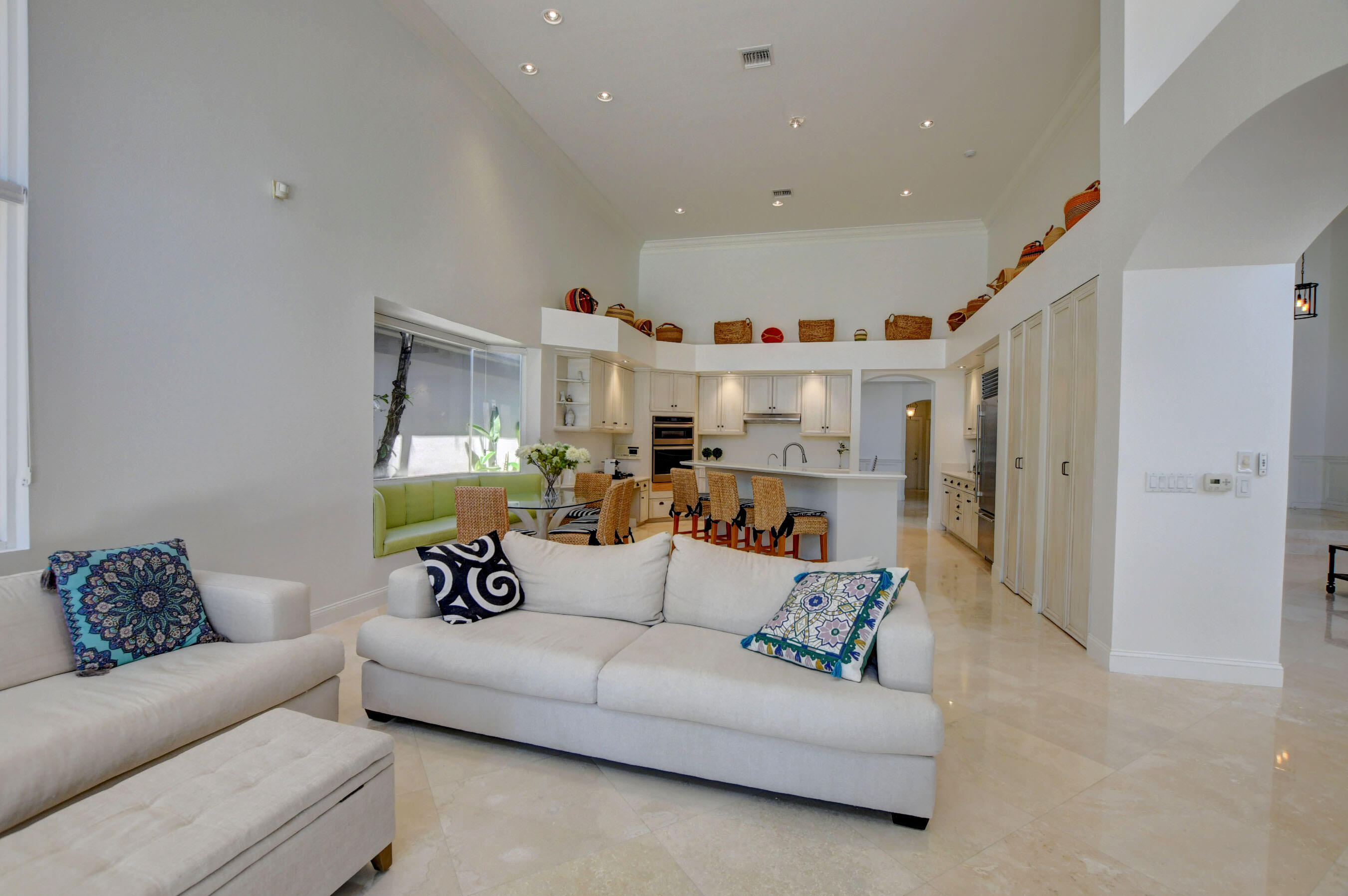 6174 Northwest 24th Way Boca Raton, FL 33496 - Photo 15 of 58 a living room with furniture and a chandelier