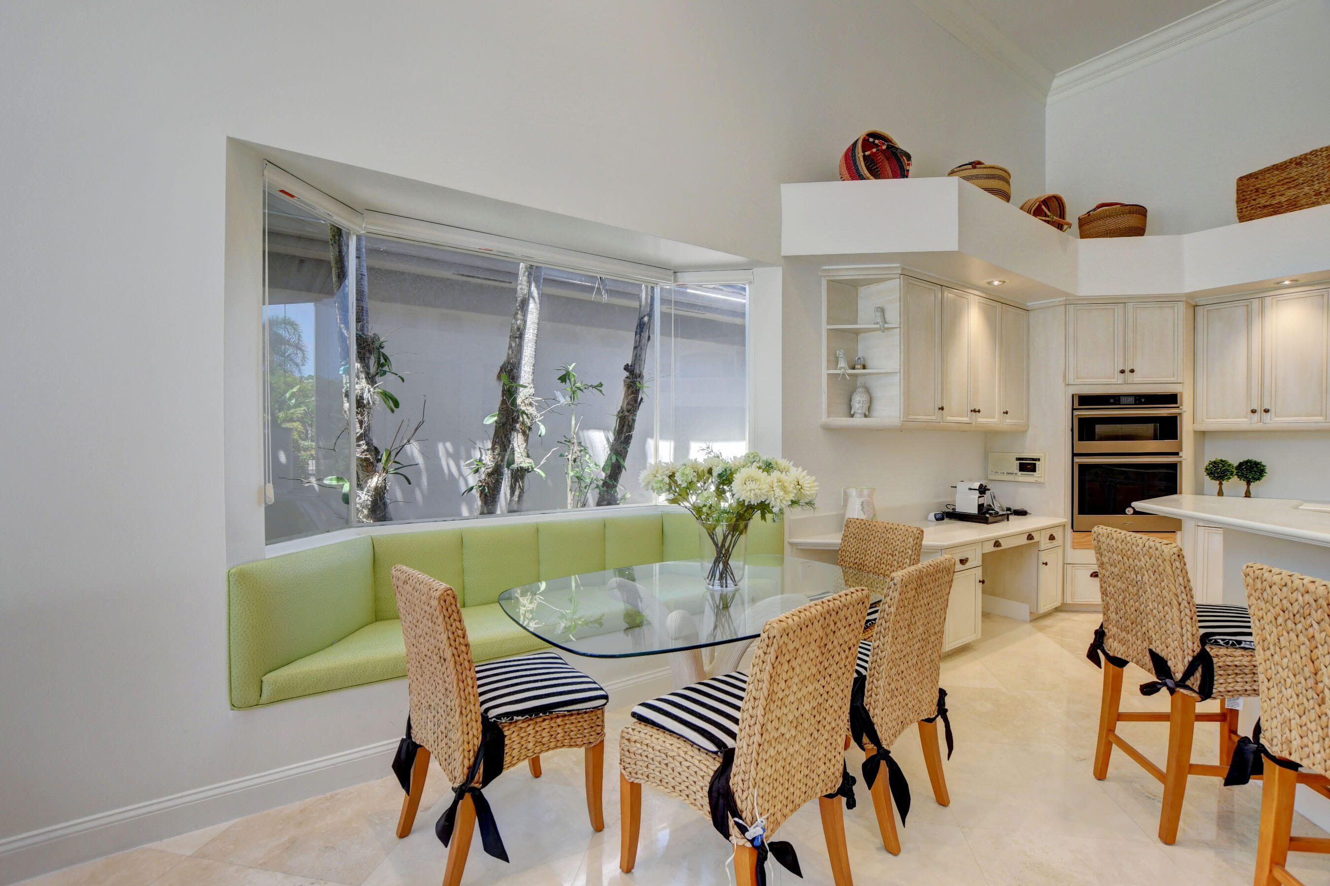 6174 Northwest 24th Way Boca Raton, FL 33496 - Photo 17 of 58 a view of a dining room with furniture and wooden floor