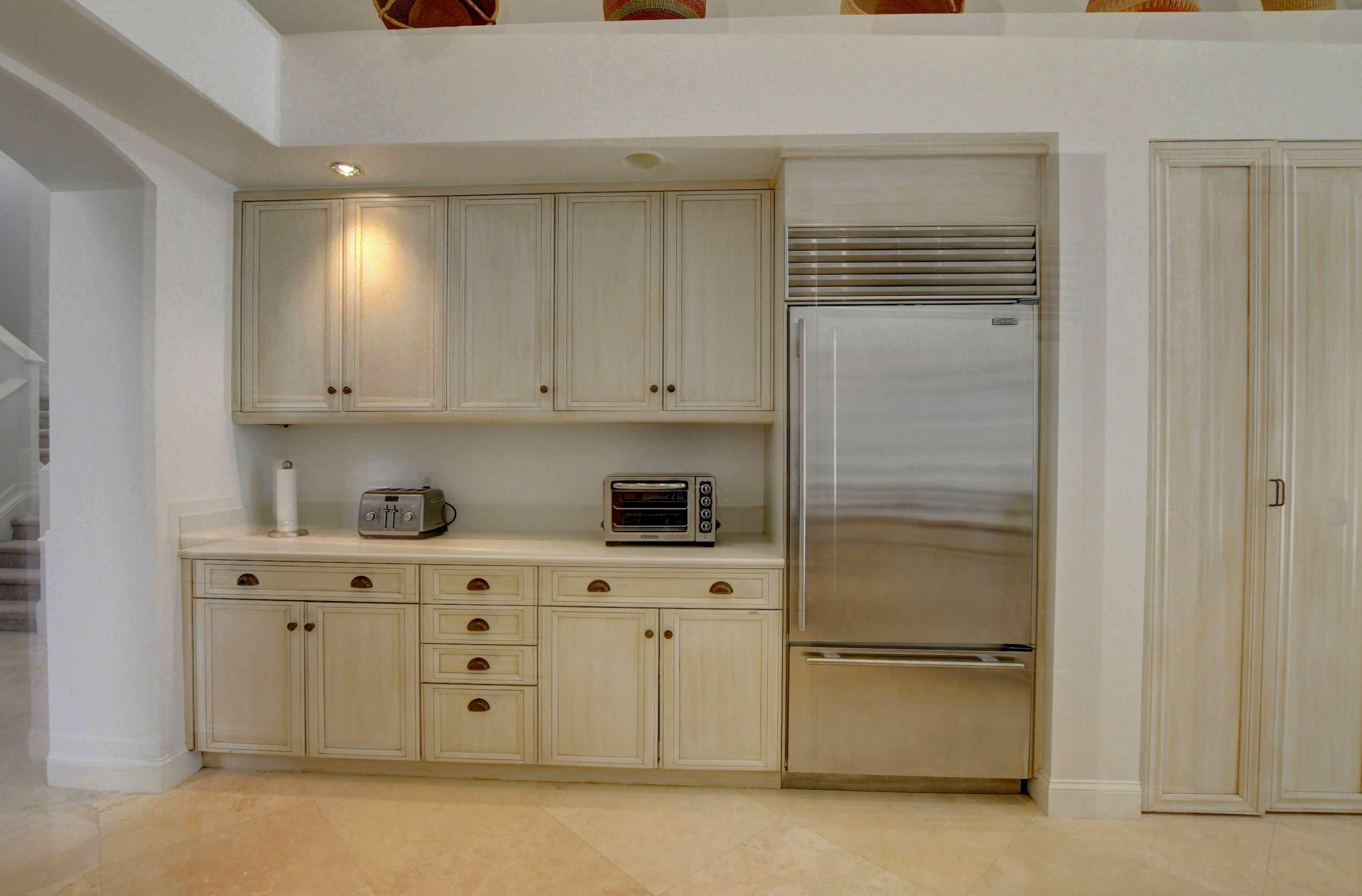 6174 Northwest 24th Way Boca Raton, FL 33496 - Photo 21 of 58 a kitchen with white cabinets and white appliances